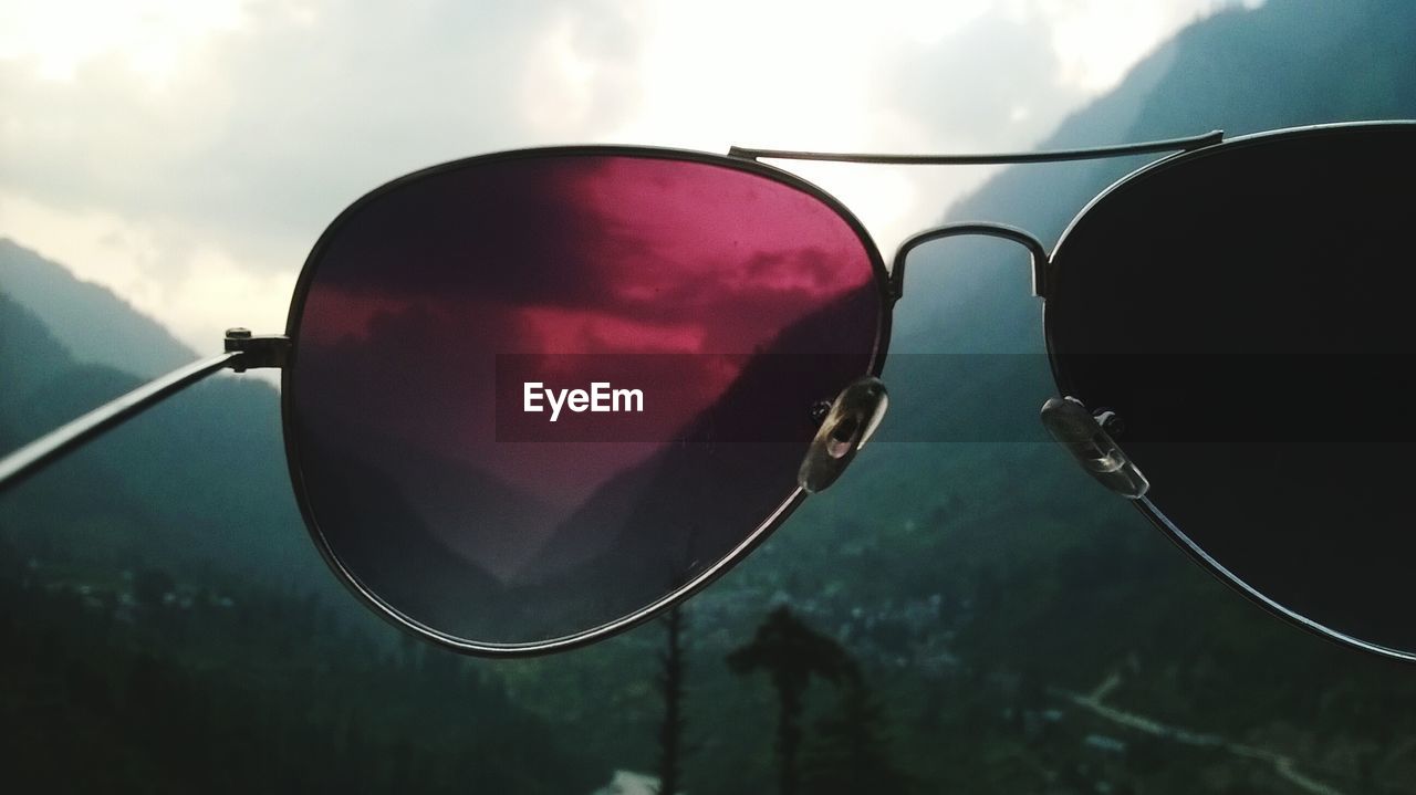 Scenic view of mountains seen through sunglasses