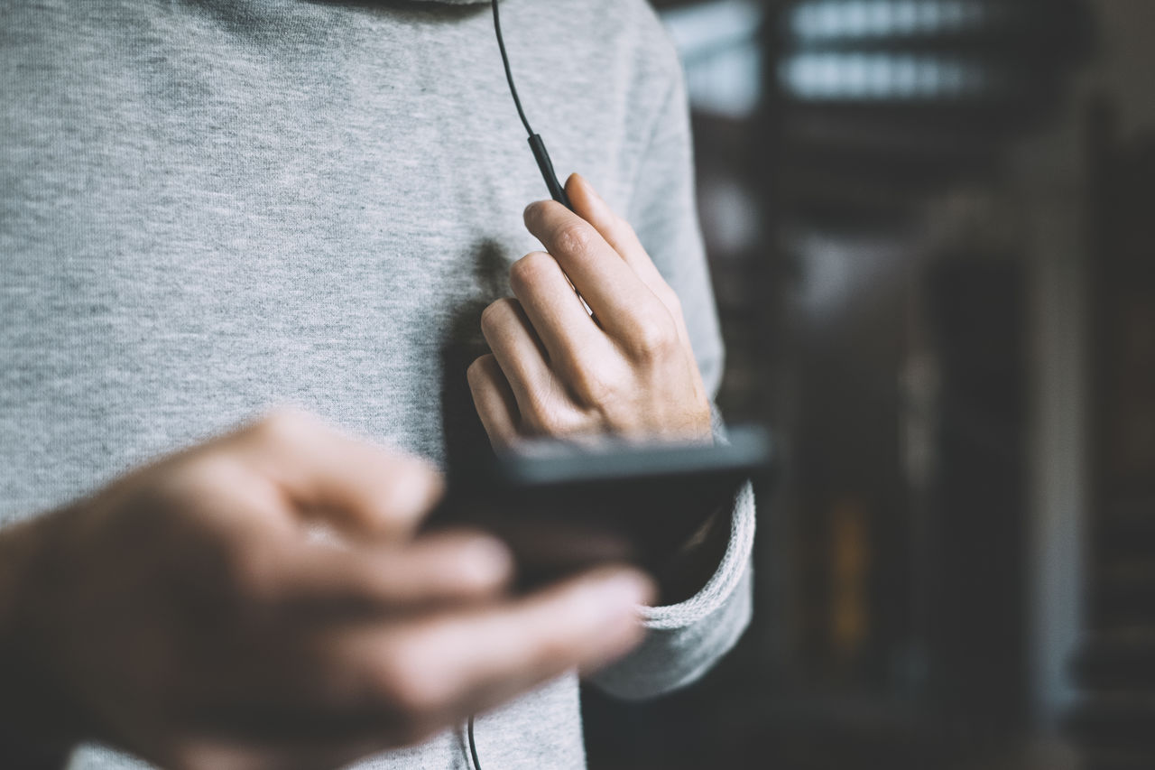 Close-up of man holding phone