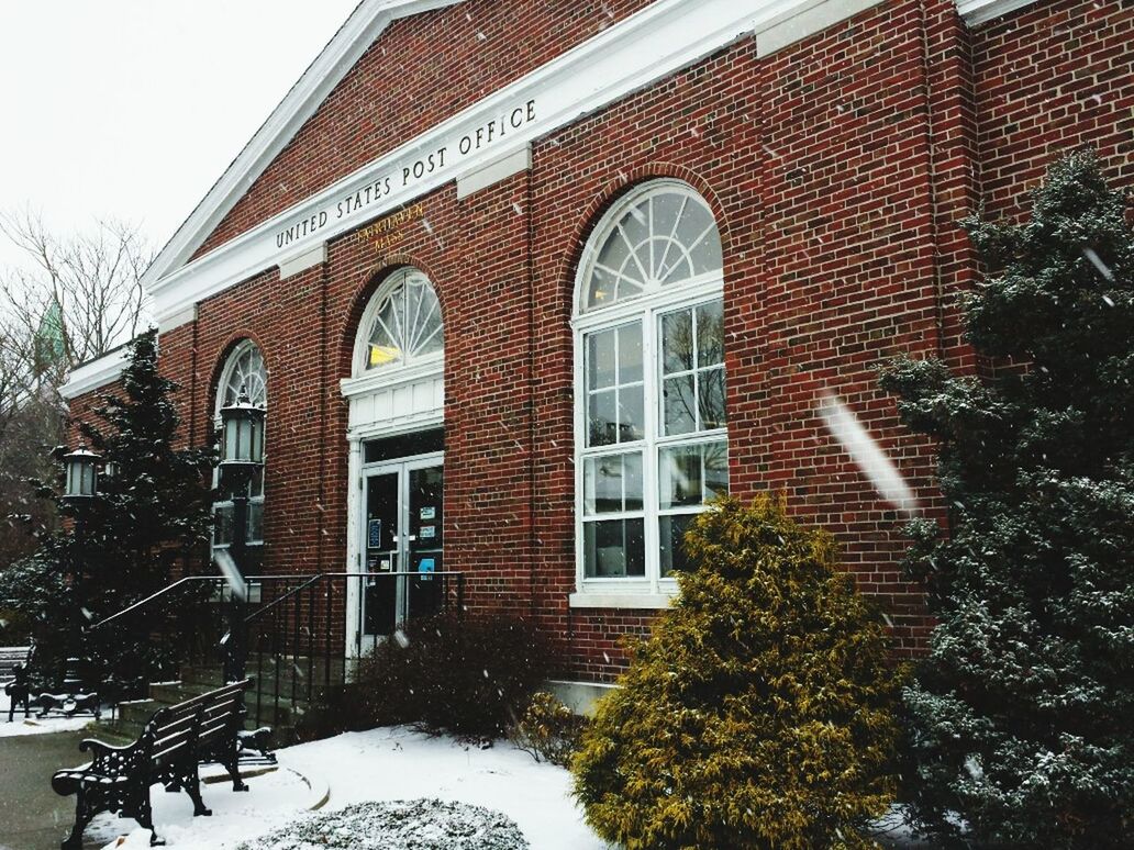 VIEW OF BUILDING WITH TREES IN BACKGROUND