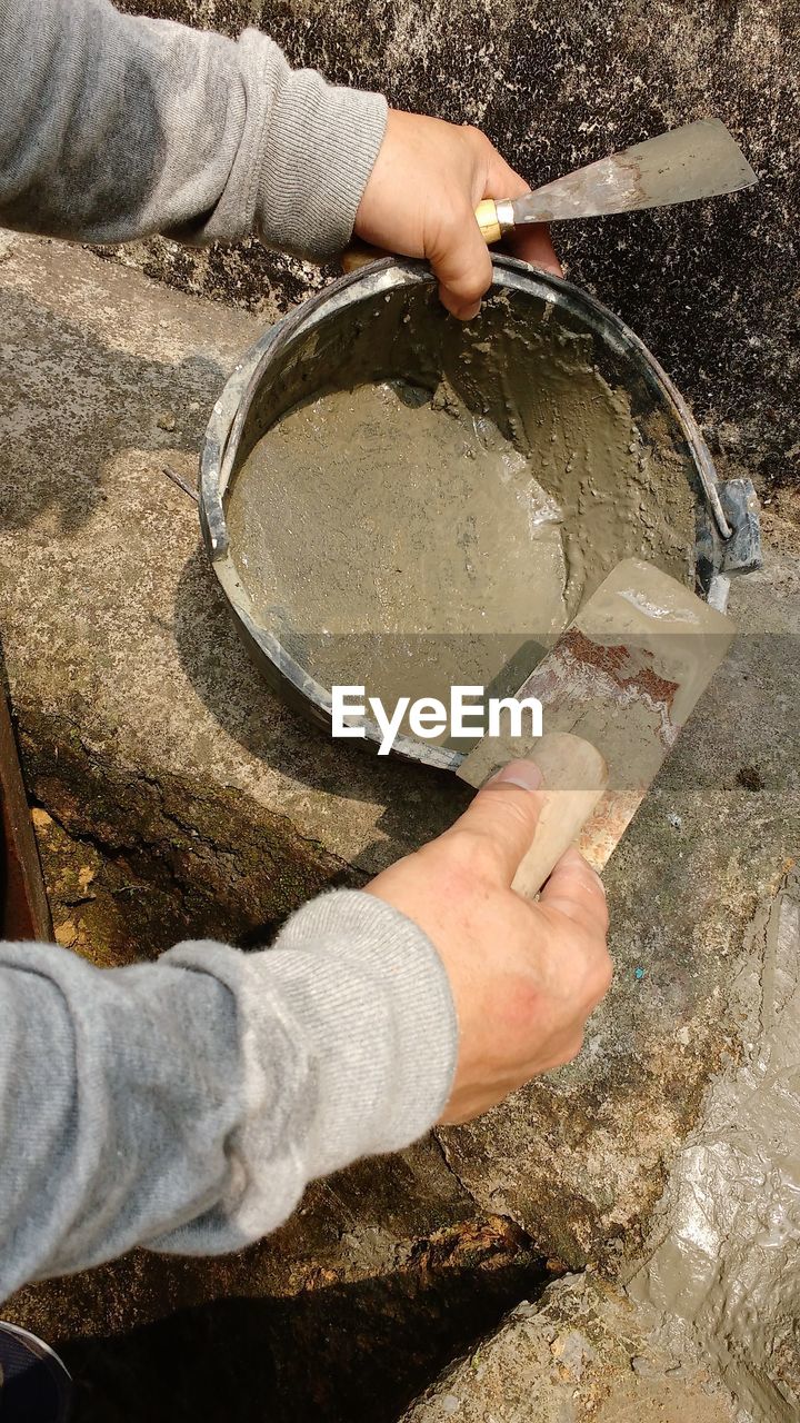 High angle view of man laying cement