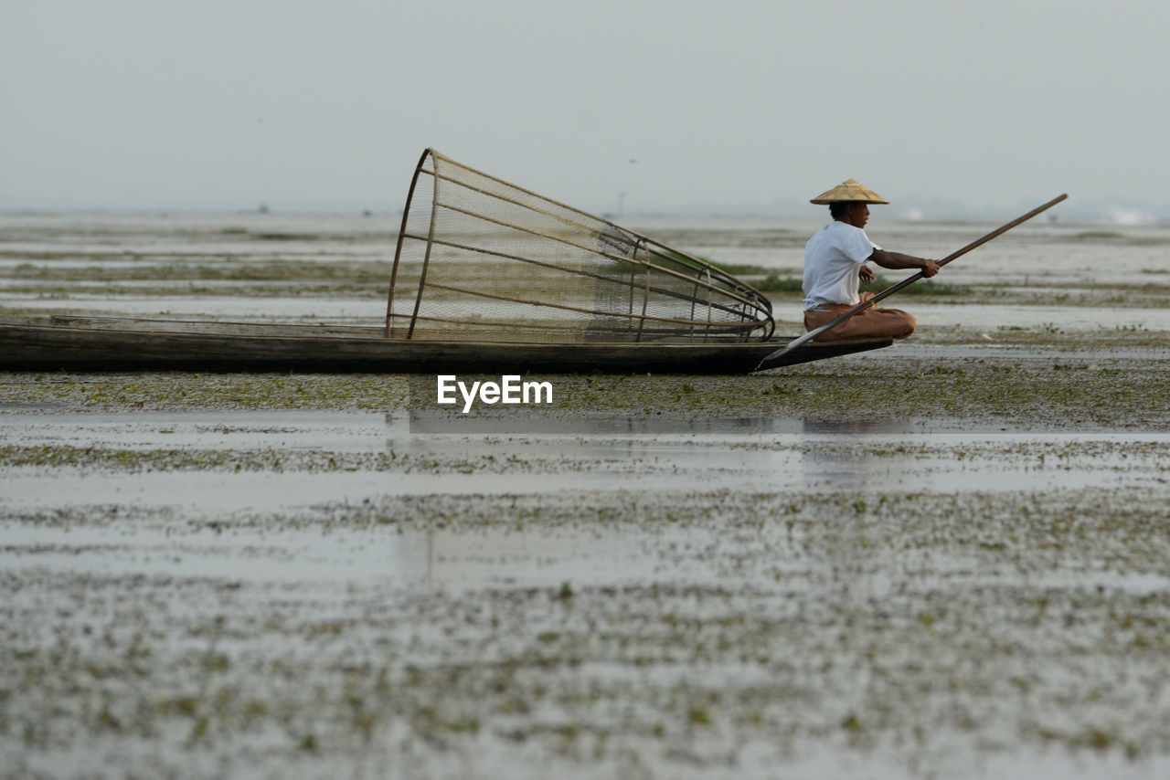 Man fishing in lake