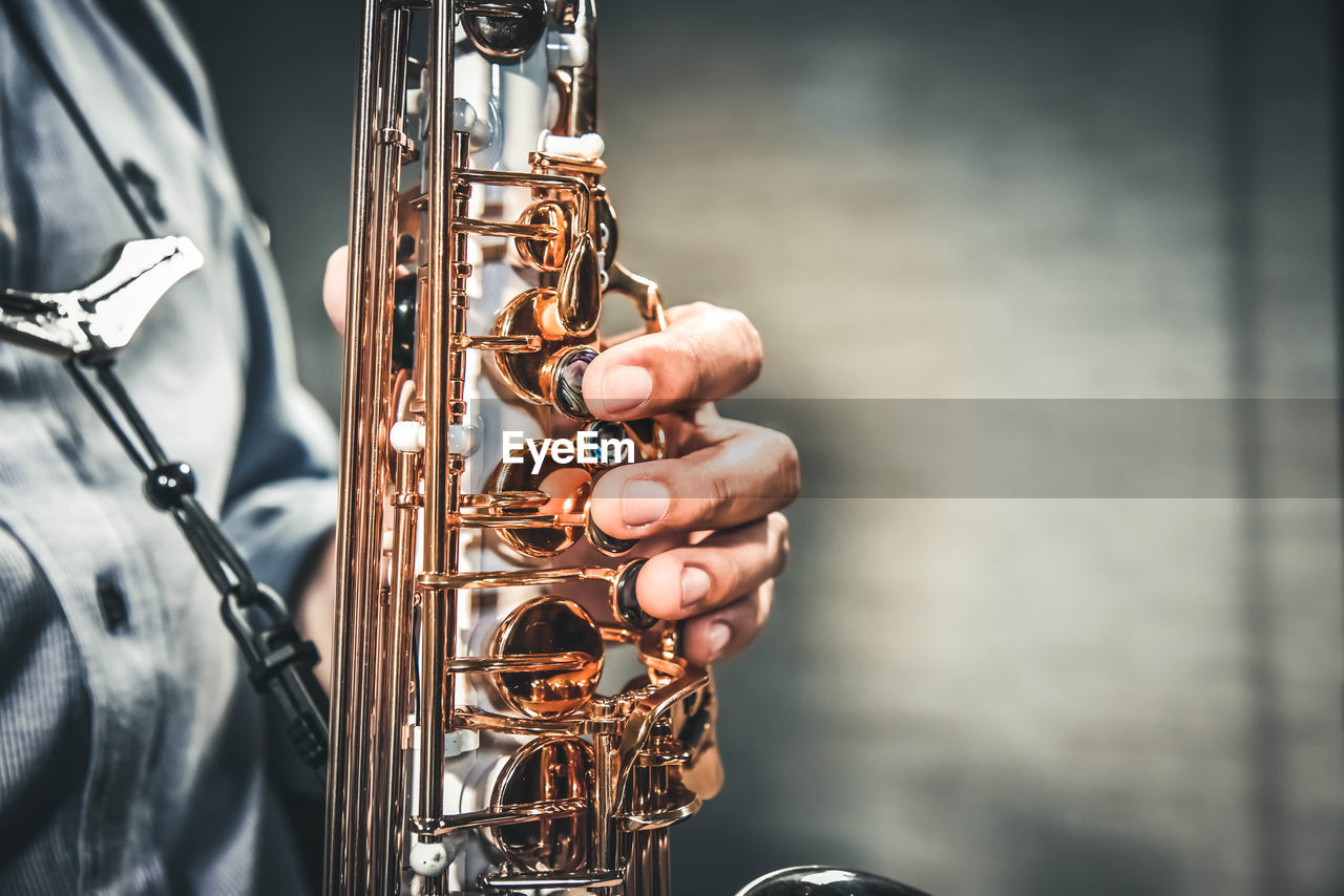 Close-up of man playing instrument