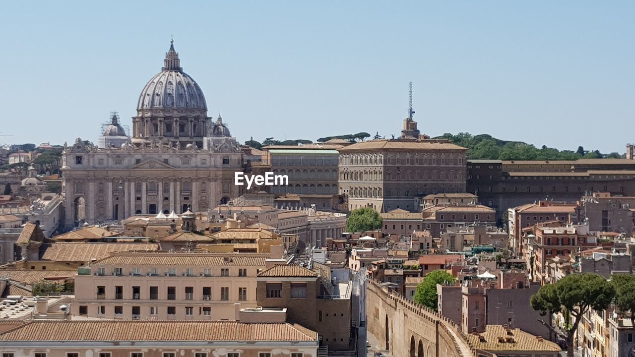 High angle view of buildings in city against clear sky