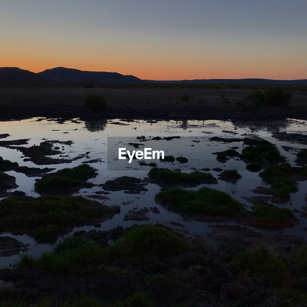 SCENIC VIEW OF SUNSET OVER LAND