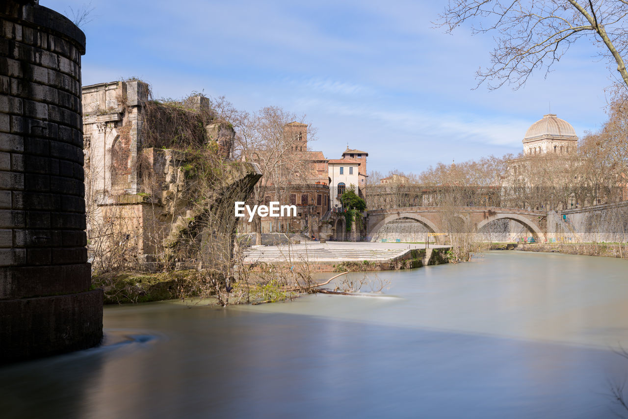 Ancient roman bridge, collapsed, over tiber river in rome, italy