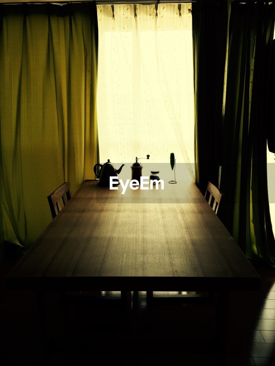 curtain, indoors, illuminated, table, no people, drapes, day