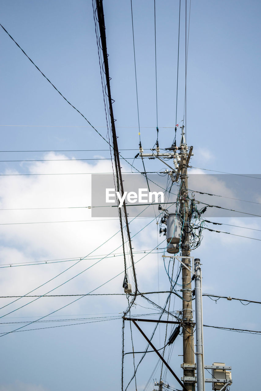 LOW ANGLE VIEW OF ELECTRICITY POLE AGAINST SKY