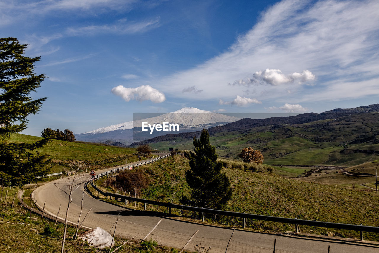 High angle view of road by landscape against sky