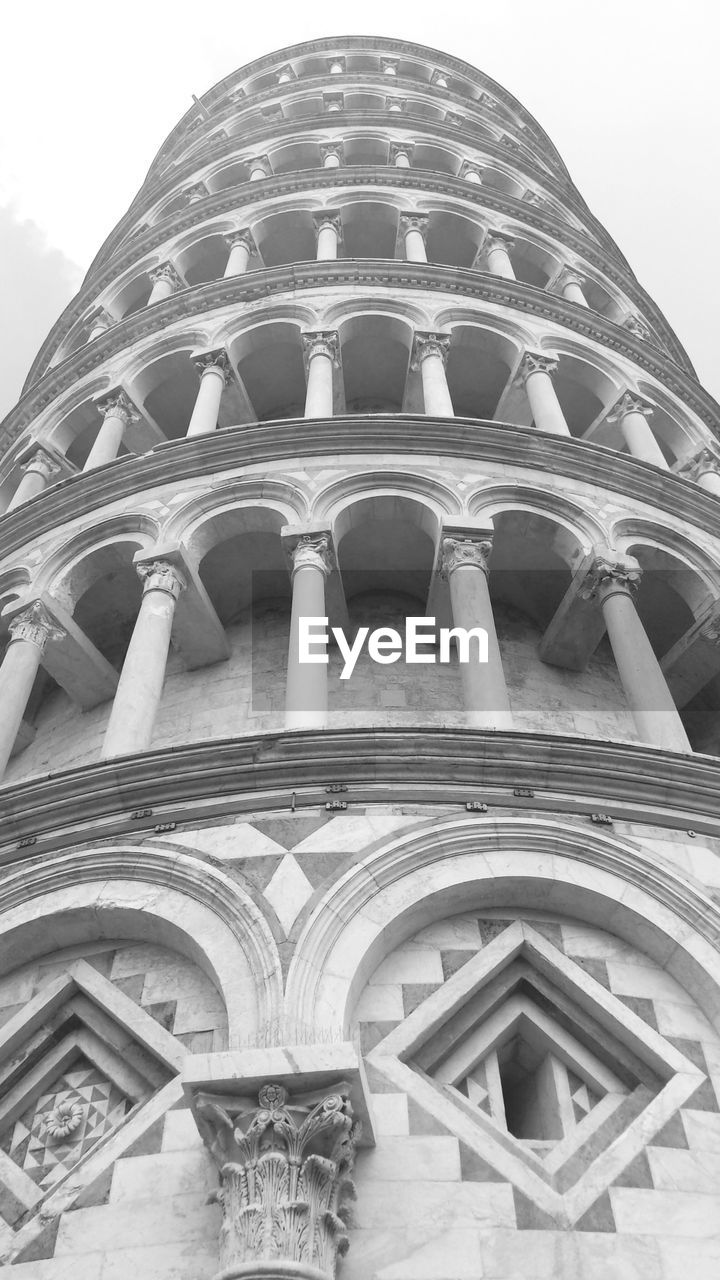 Low angle view of leaning tower of pisa against clear sky