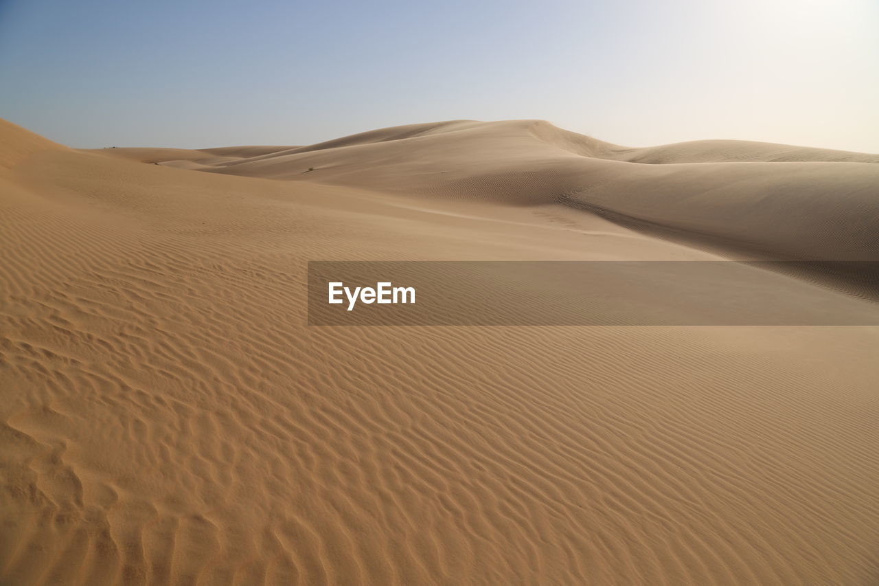 Scenic view of desert against clear sky