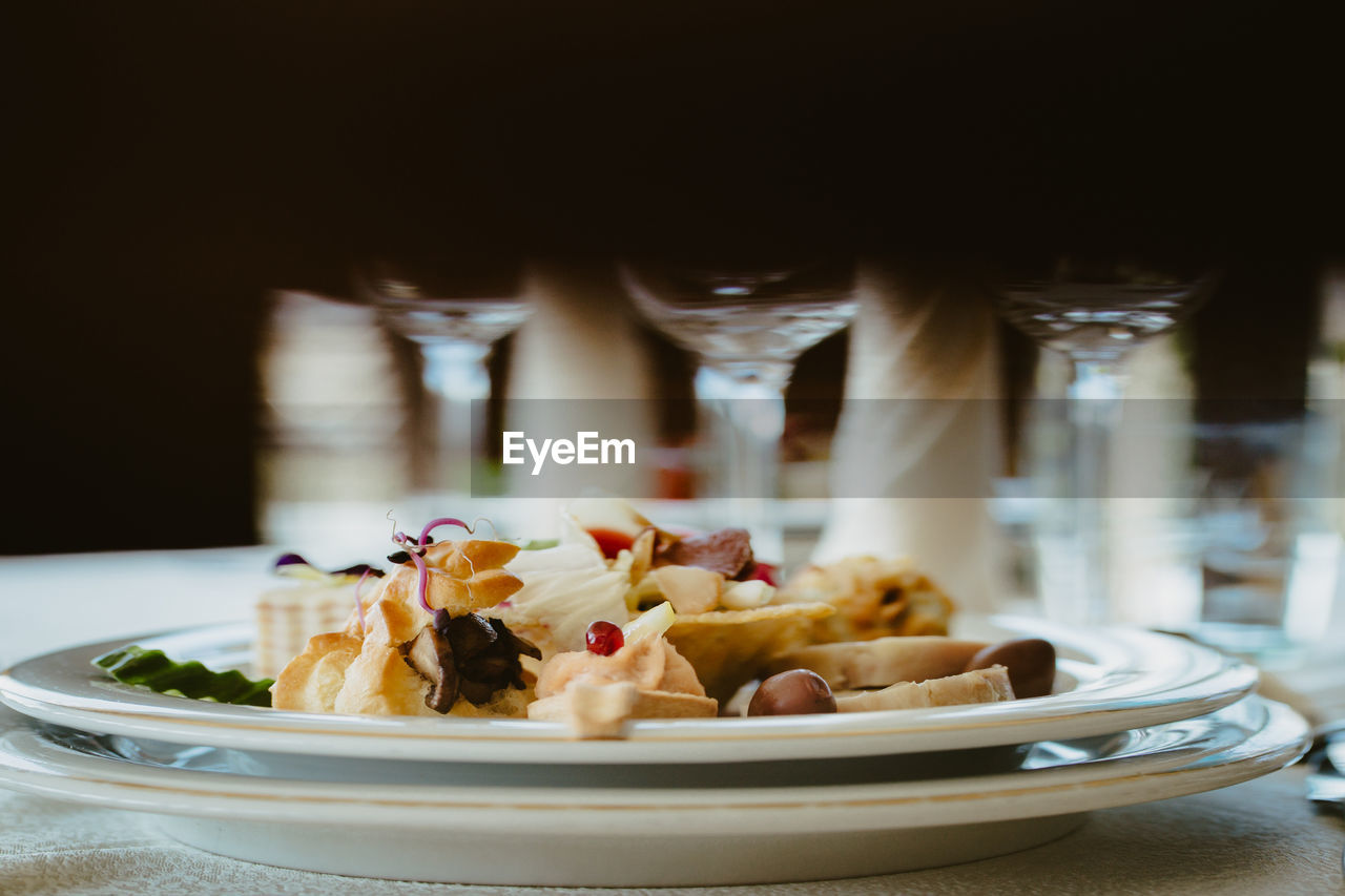 CLOSE-UP OF FOOD SERVED ON TABLE