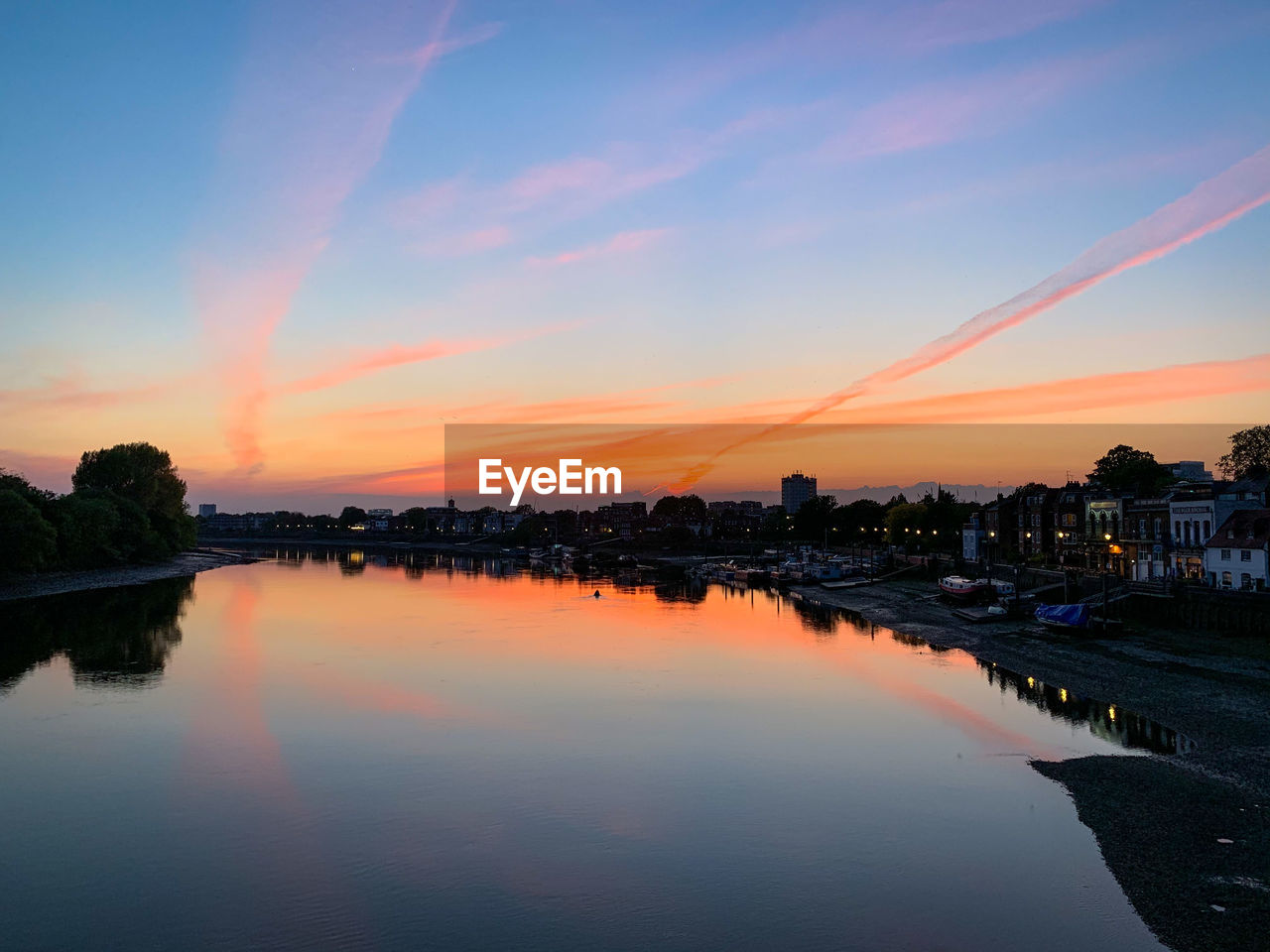 SCENIC VIEW OF RIVER AGAINST ROMANTIC SKY