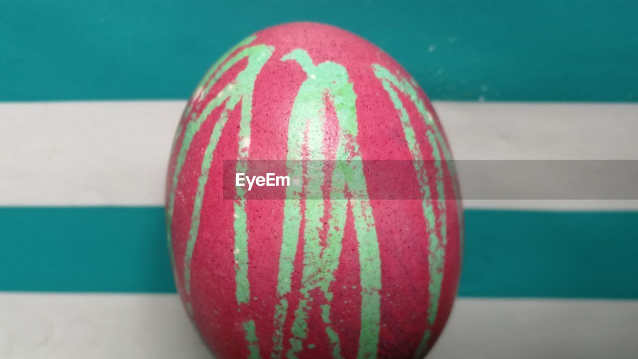 High angle view of coloured egg on table