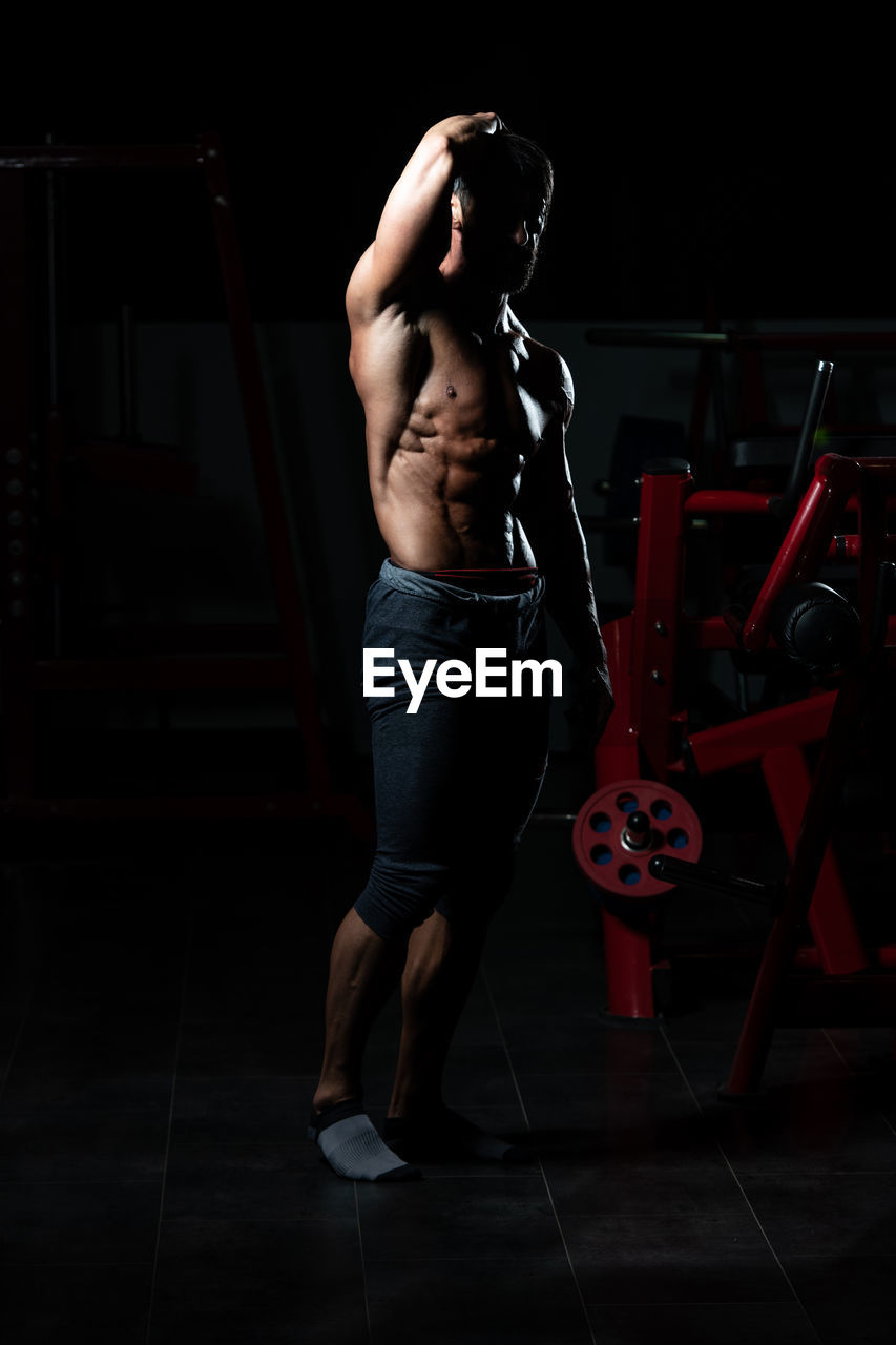 low section of man exercising on floor