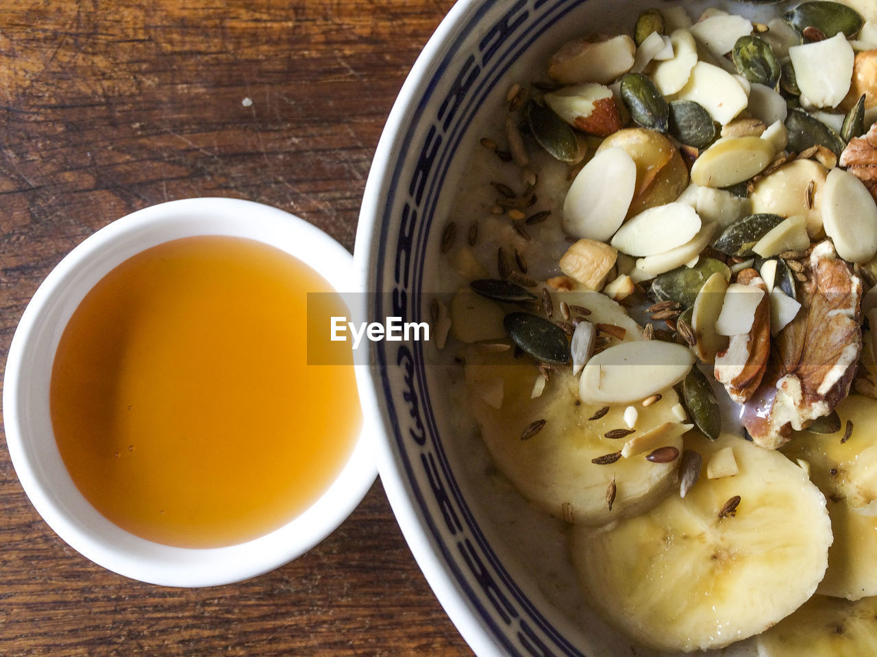 Close-up of muesli with honey served on table