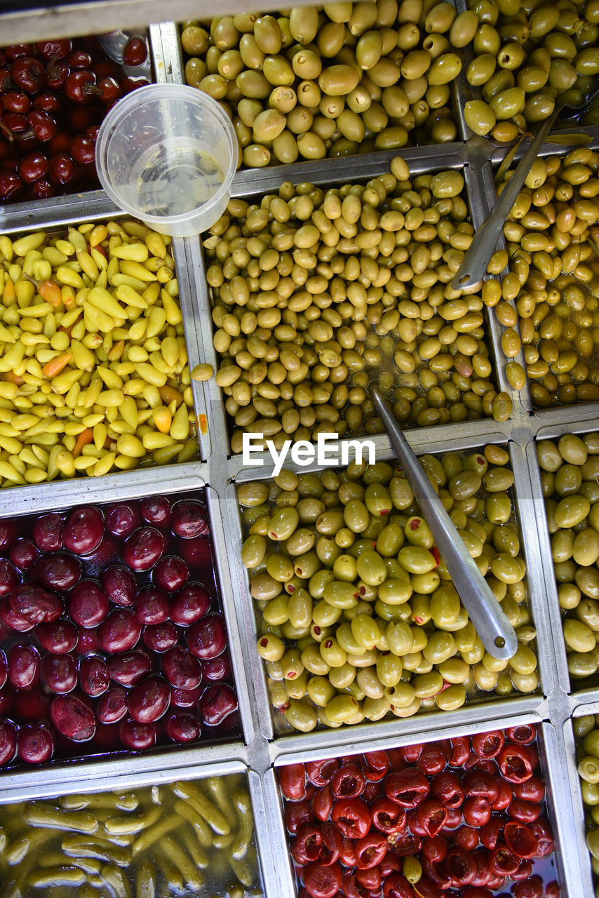 Close-up of pickles and colored olives. levinsky market, tel aviv