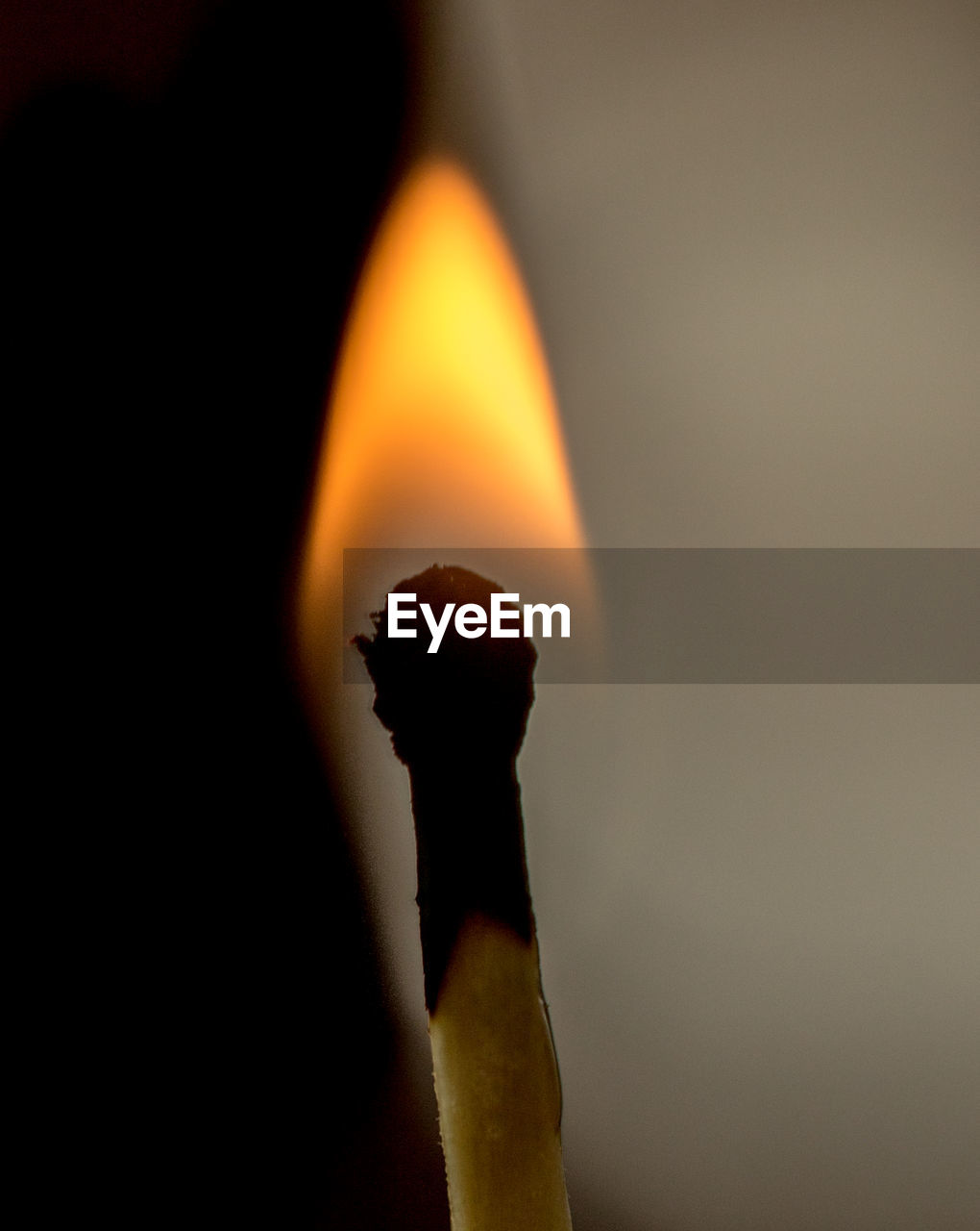 Close-up of lit matchstick