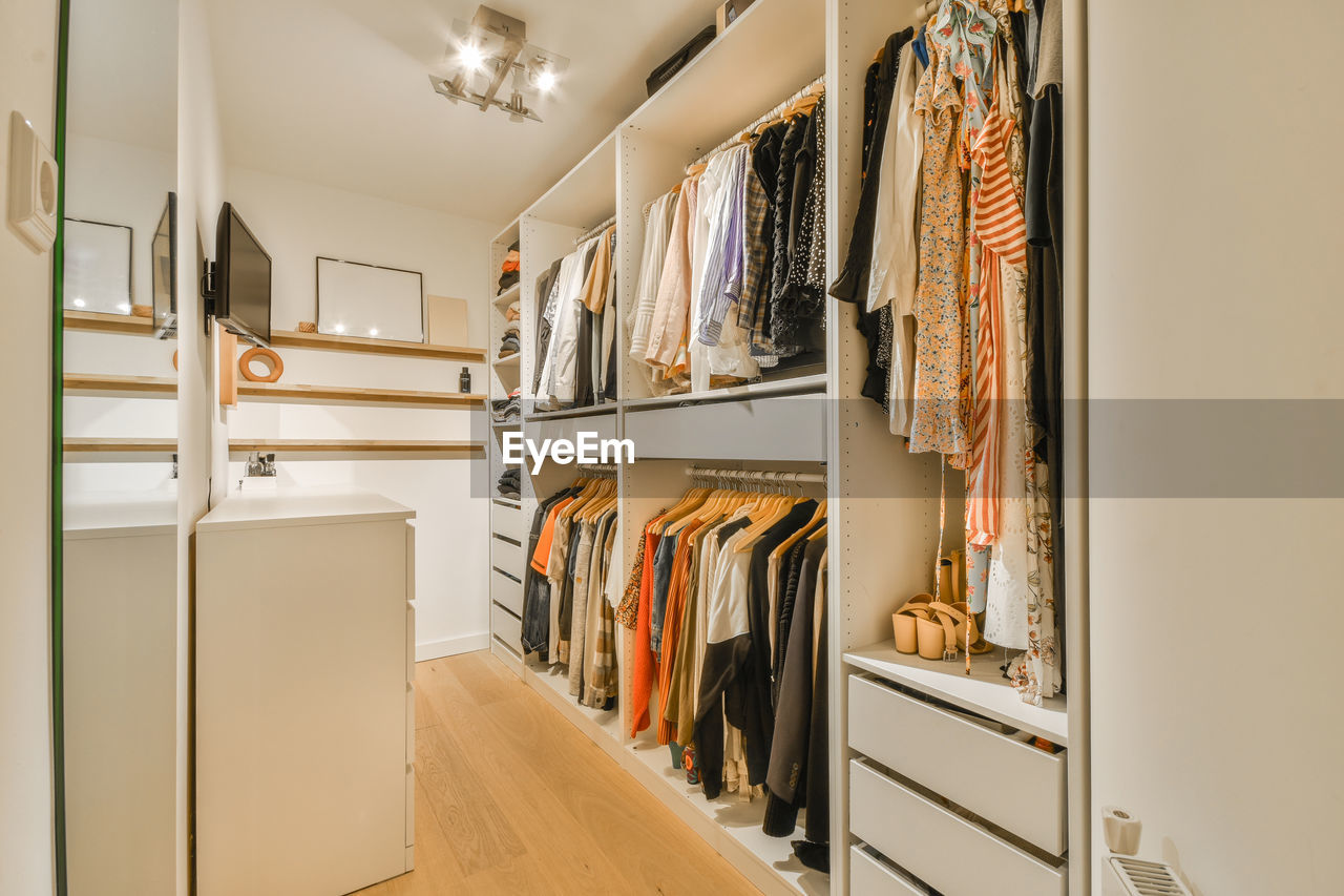 low angle view of clothes hanging in shelf