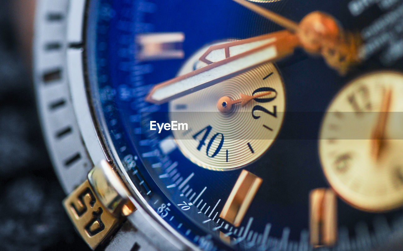 CLOSE-UP OF CLOCK ON METAL