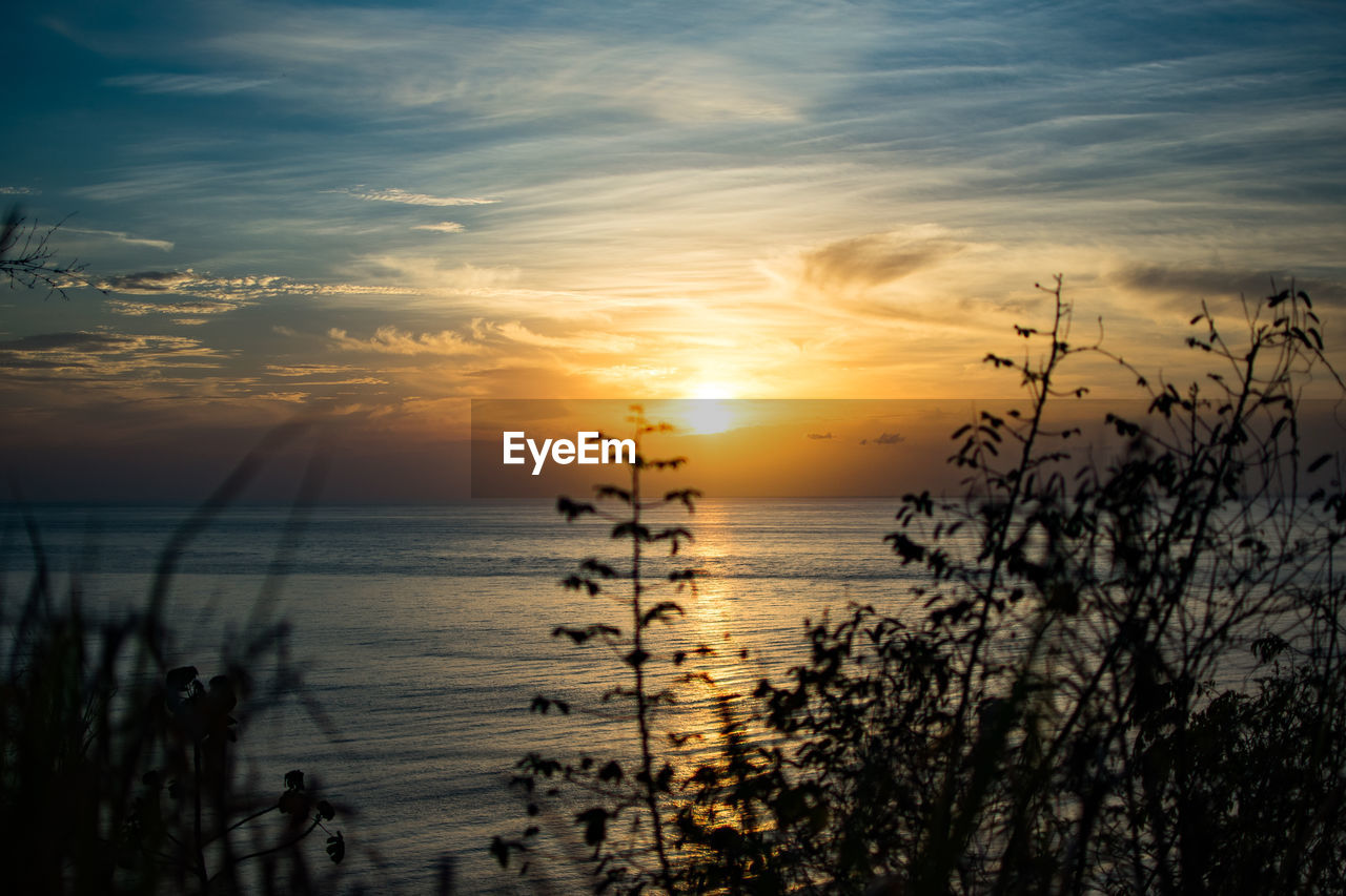 SCENIC VIEW OF SEA DURING SUNSET