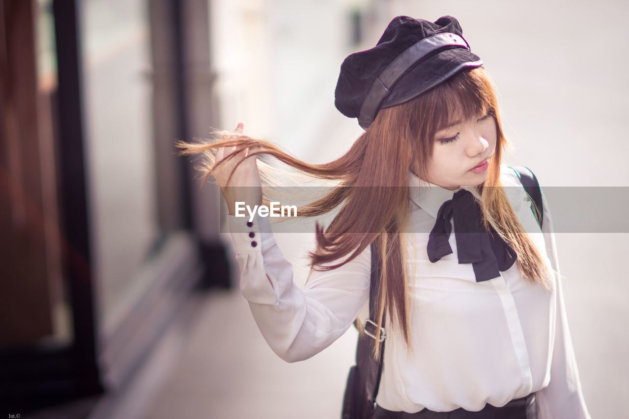 Young woman wearing hat