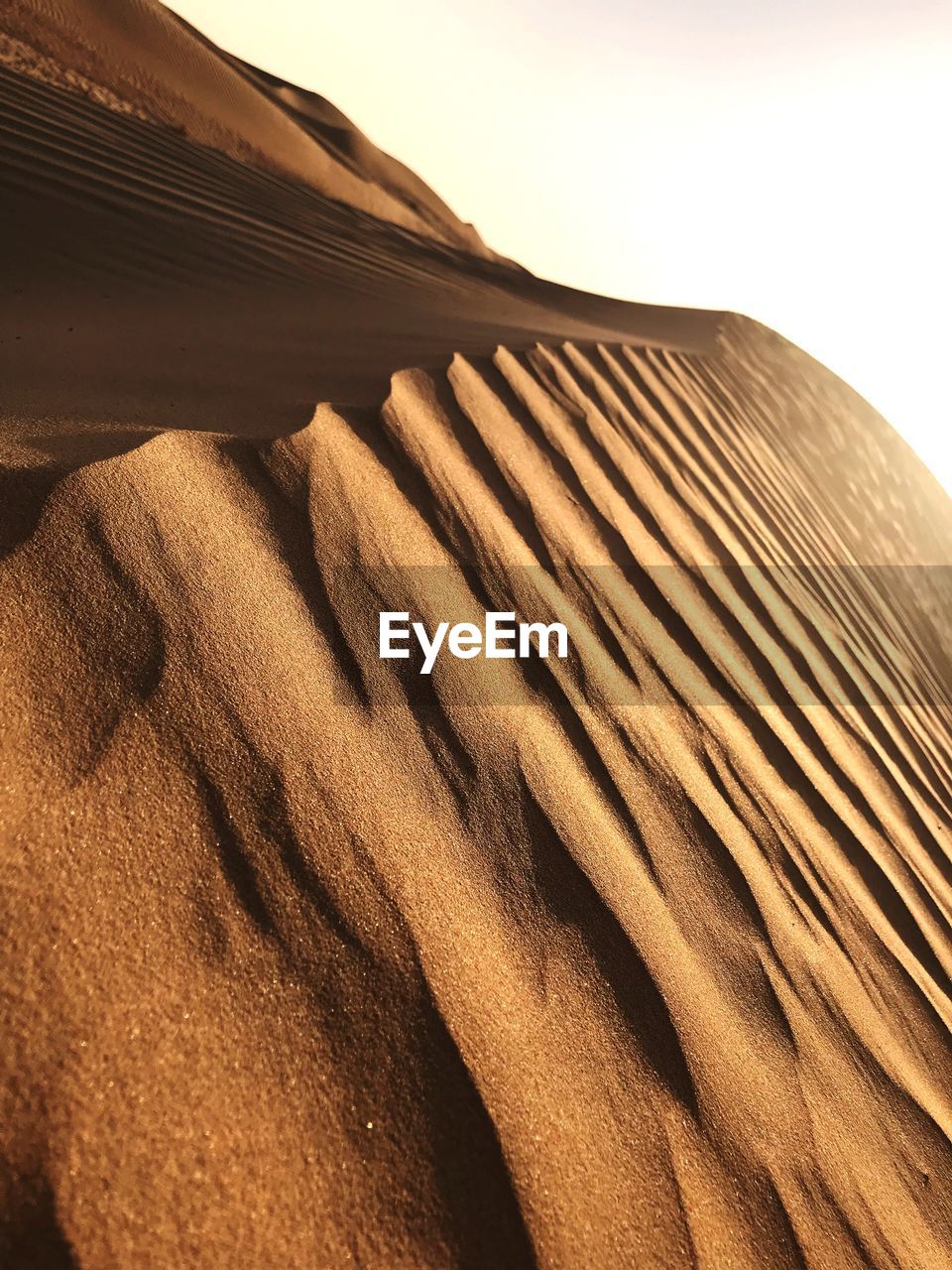 SAND DUNES AGAINST SKY