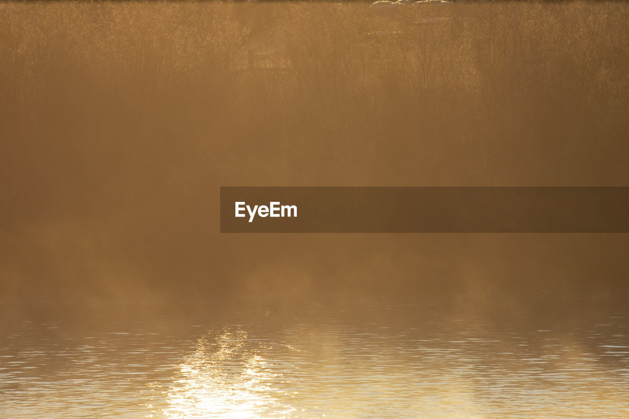 Mist rises off of the clark fork river at sunrise