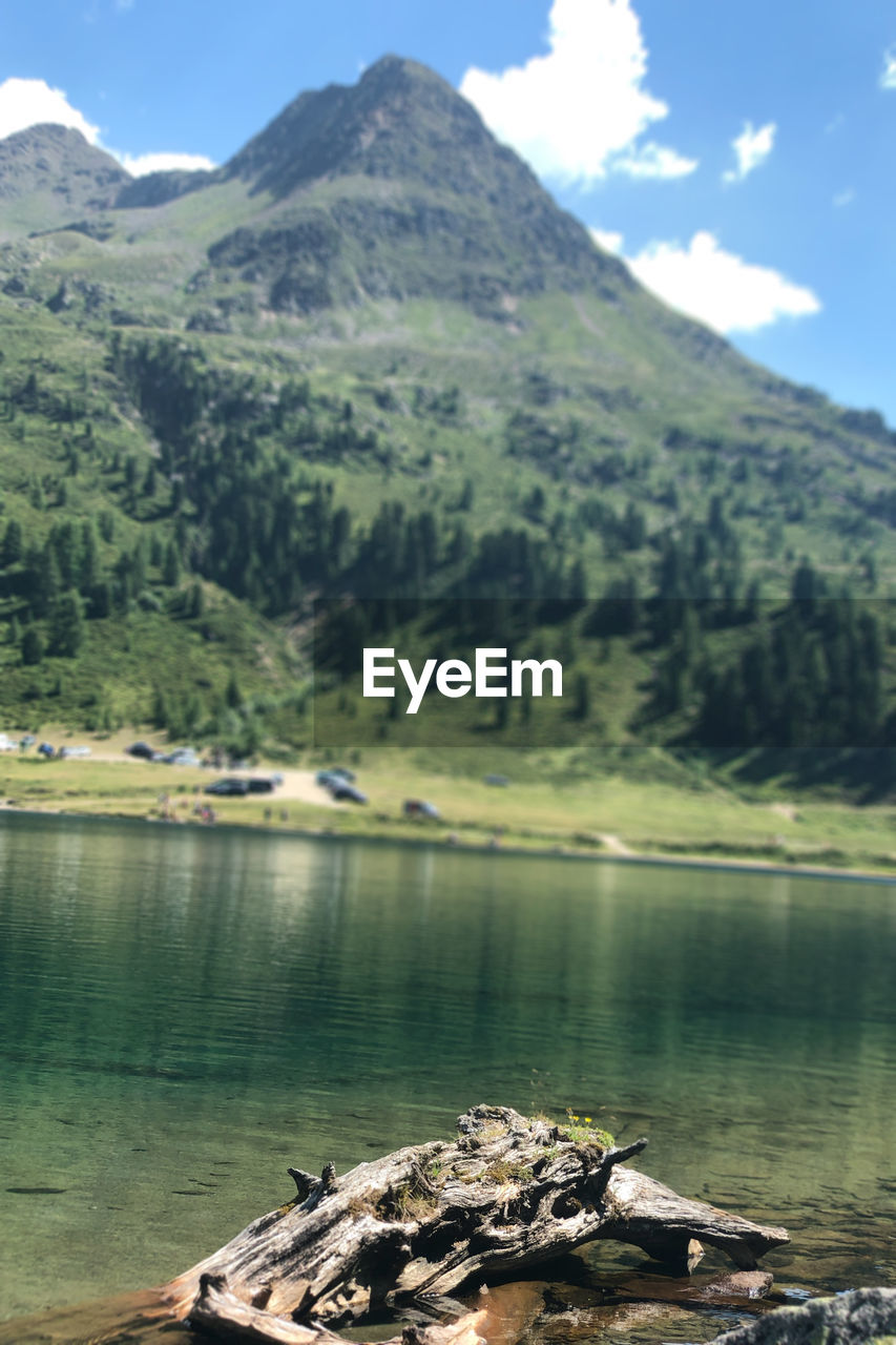 Scenic view of lake and mountains against sky