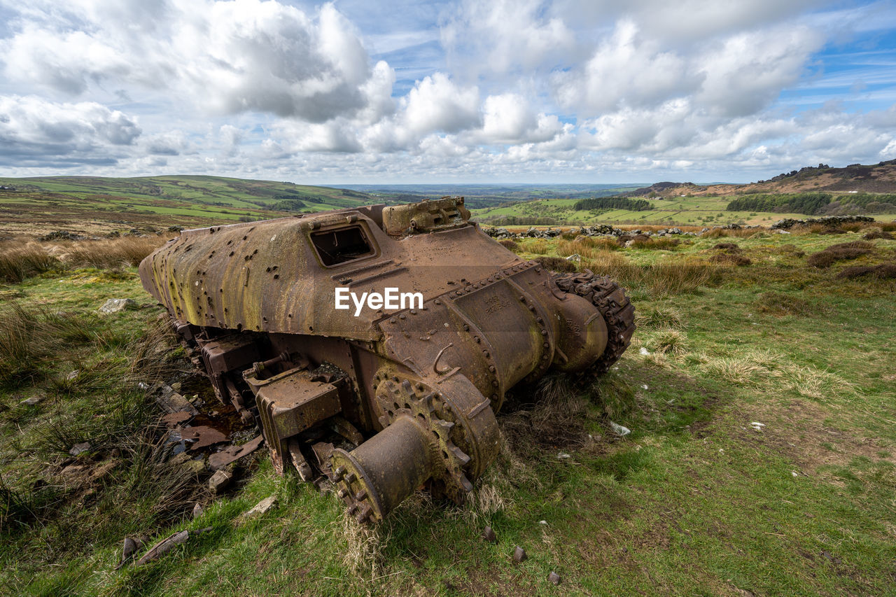 abandoned car on field