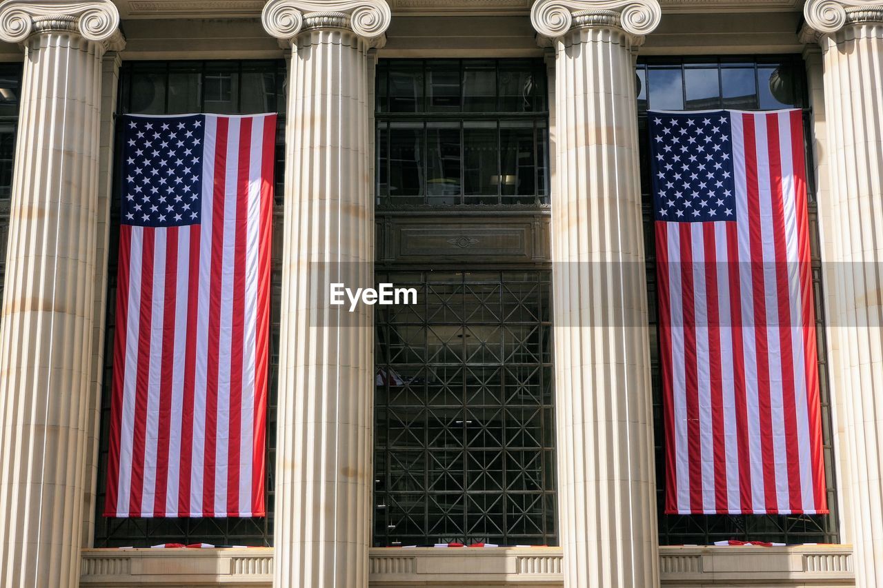 LOW ANGLE VIEW OF FLAGS IN BUILDING