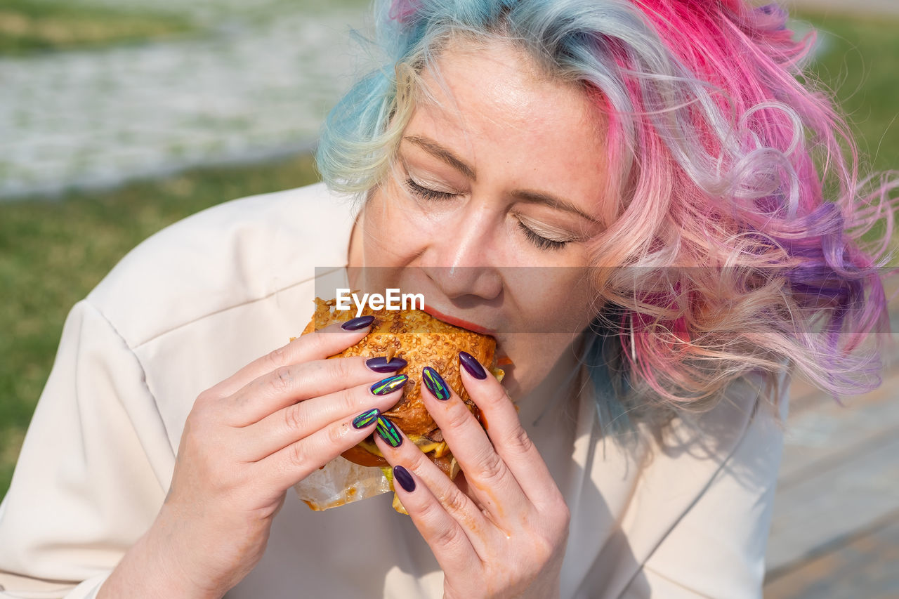 Portrait of woman eating food