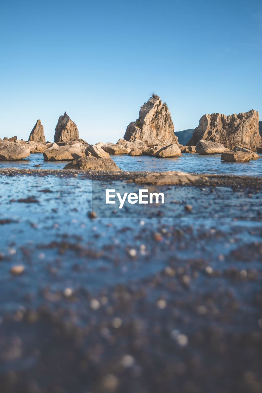 scenic view of sea against clear blue sky