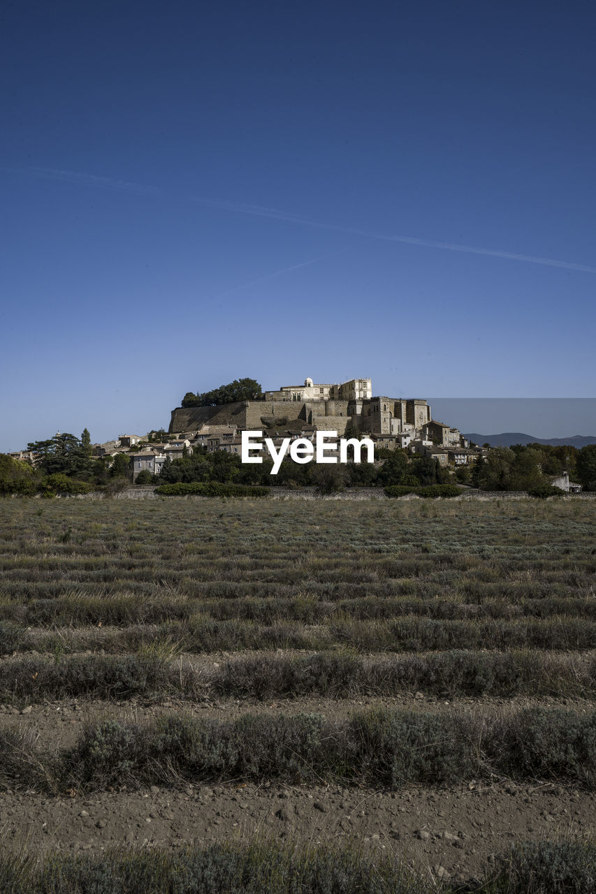 The famous typical grignan village in provence at sunrise from above - france