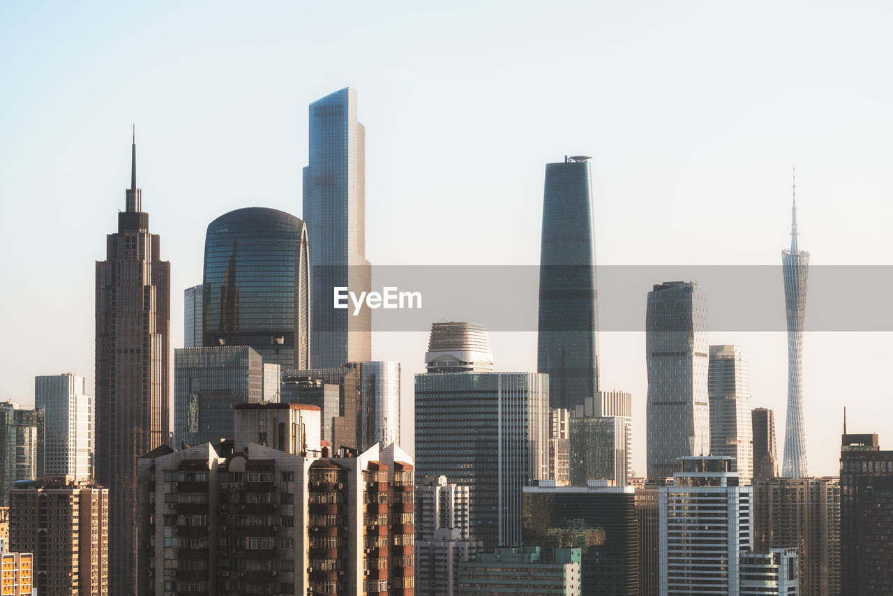 Skyscrapers in city against clear sky