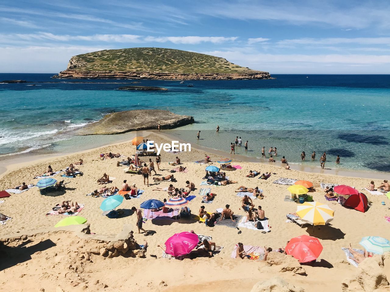 VIEW OF PEOPLE ON BEACH AGAINST SKY