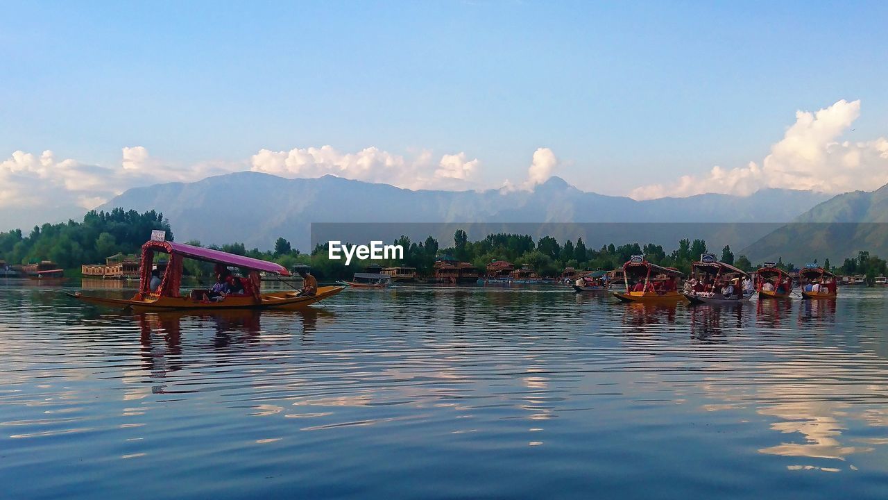 SCENIC VIEW OF LAKE WITH MOUNTAINS IN BACKGROUND