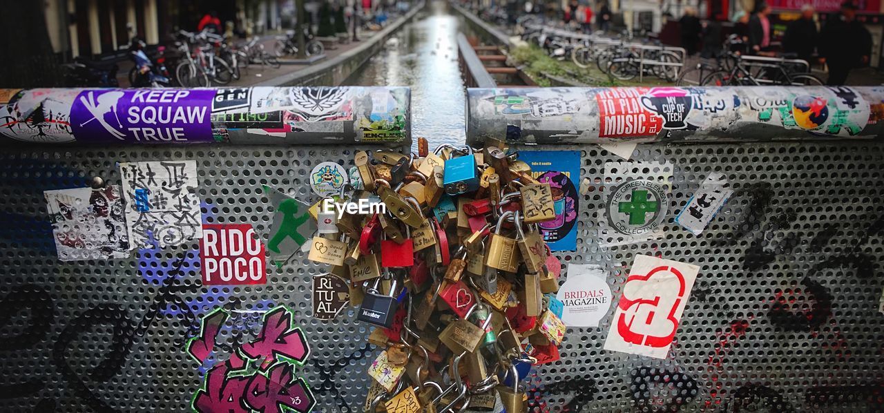 CLOSE-UP OF PADLOCKS ON RAILING