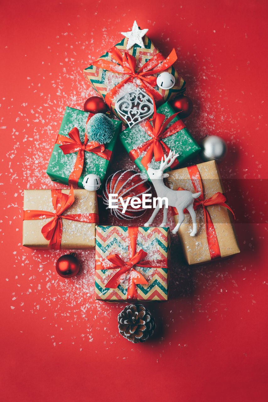 Directly above view of christmas decorations and presents on table