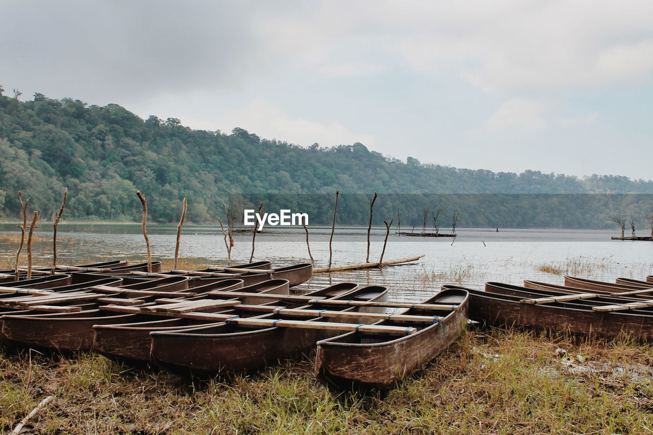 An old wooden fisherman boat the lakeside