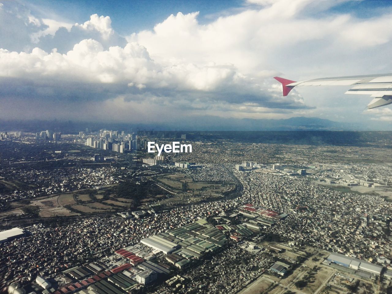 Aerial view of cityscape against sky