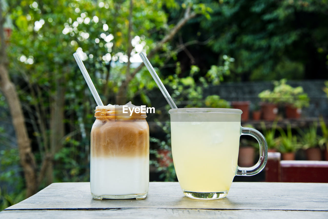 Close-up of two drink on table