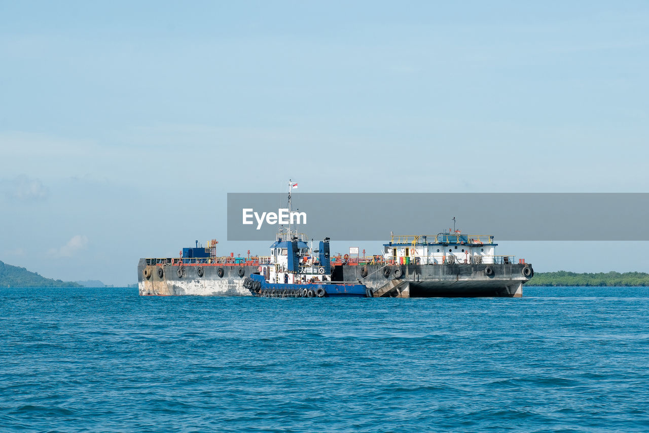 Ship in sea against sky