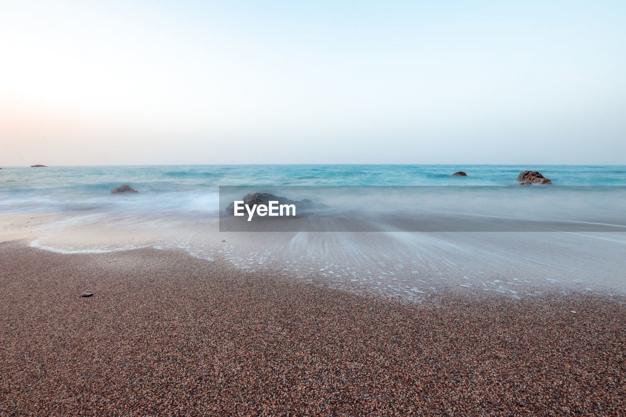 VIEW OF BEACH AGAINST CLEAR SKY