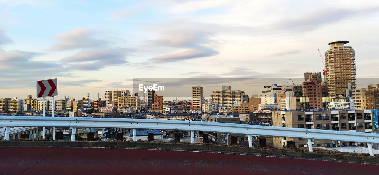 Modern buildings against sky in city
