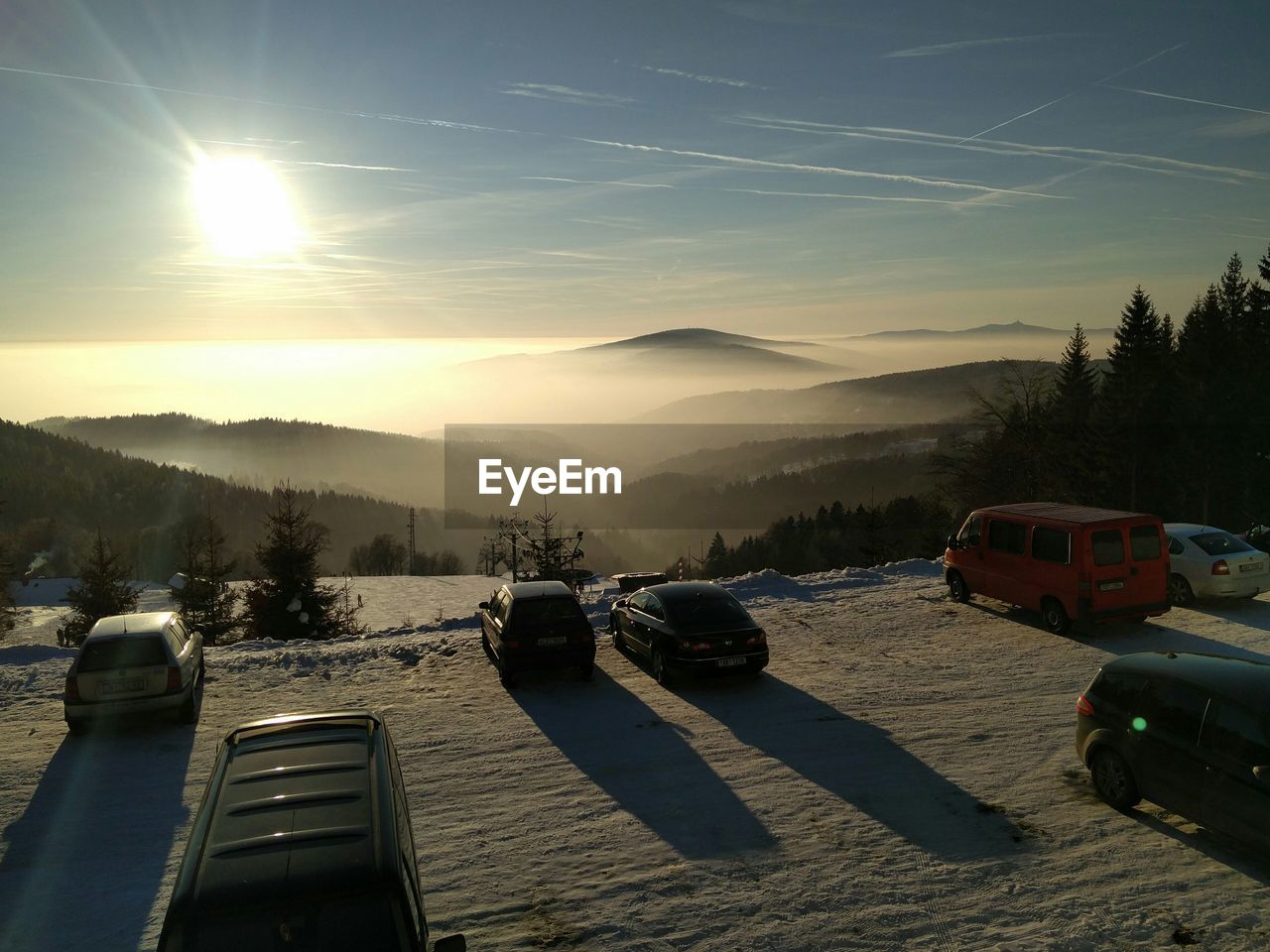 Cars on mountain against sky