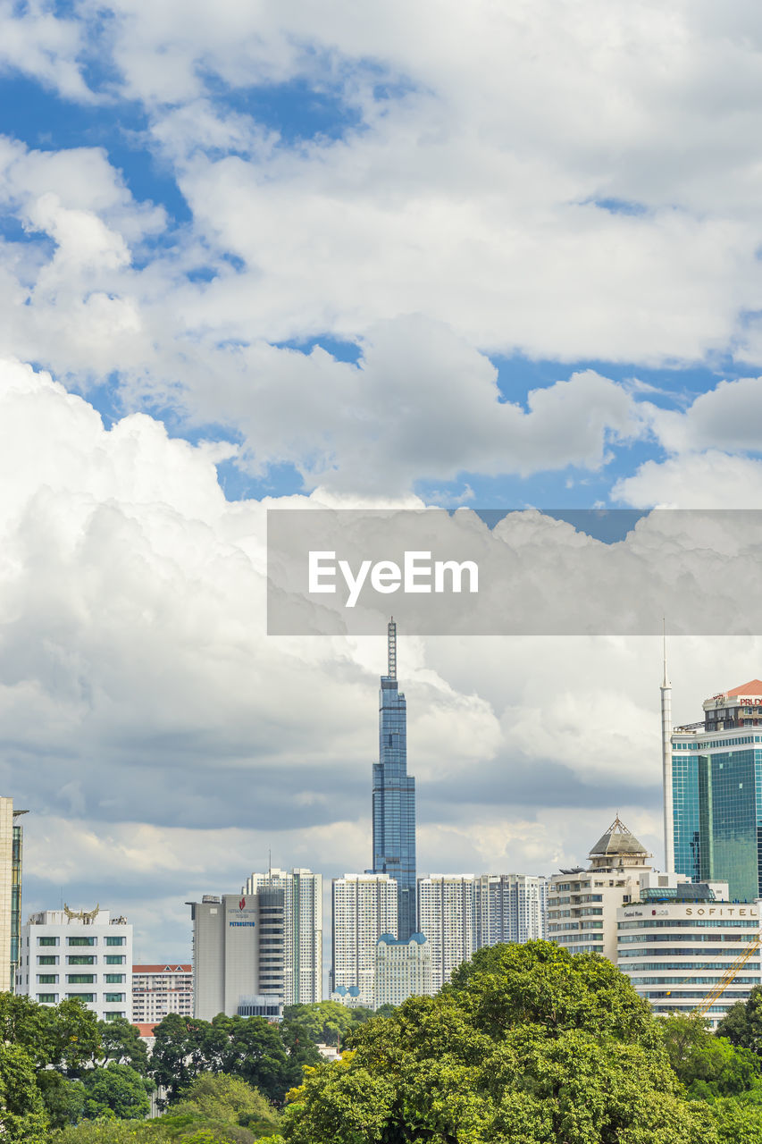 MODERN BUILDINGS AGAINST CLOUDY SKY