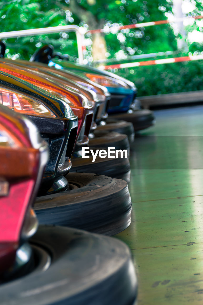 Cropped image of bumper cars at amusement park