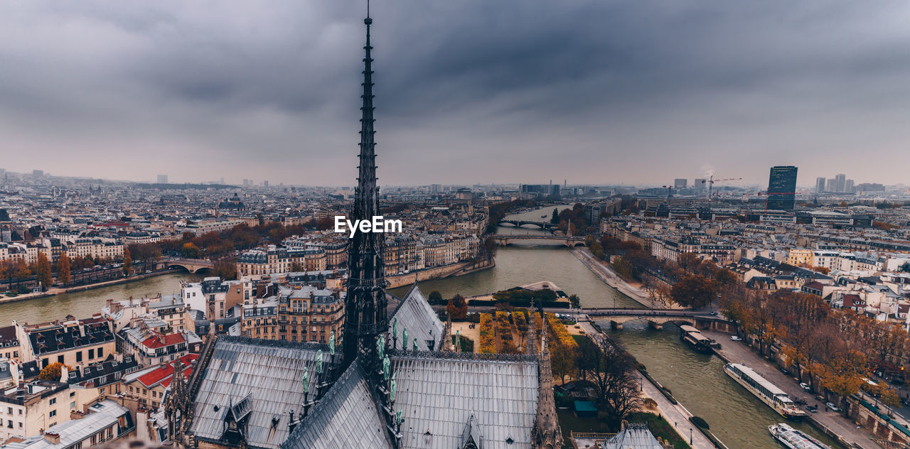 High angle view of city against cloudy sky