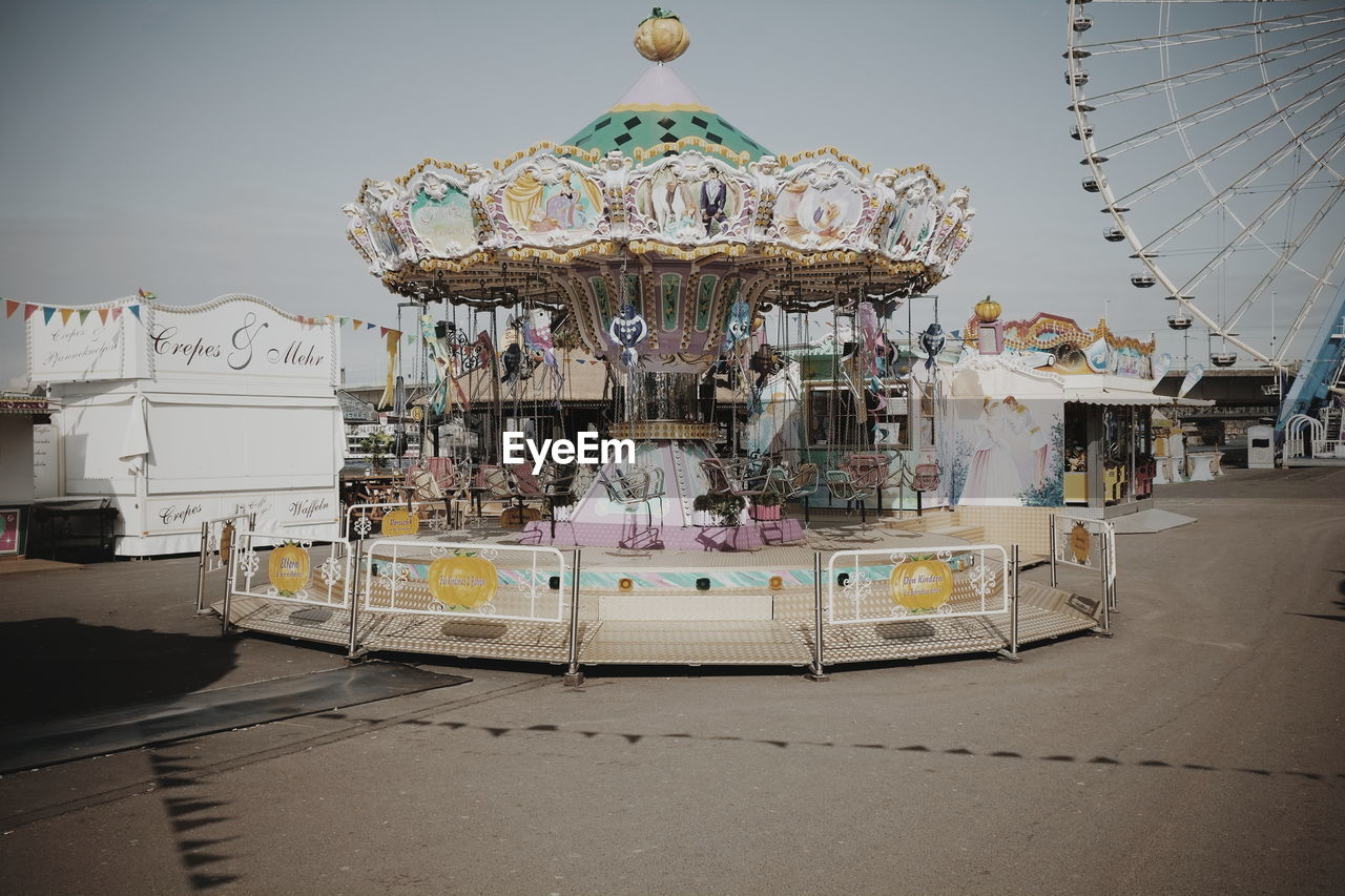 Carousel against sky in amusement park