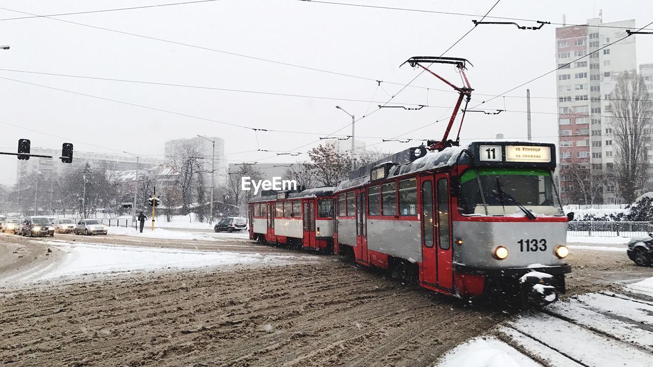 CARS ON STREET IN CITY